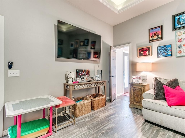 interior space featuring hardwood / wood-style floors and ornamental molding