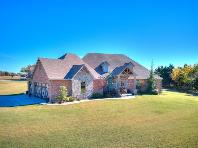 craftsman house featuring concrete driveway, brick siding, and a front lawn