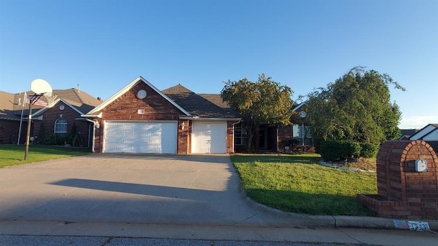 view of front of property featuring a garage and a front lawn