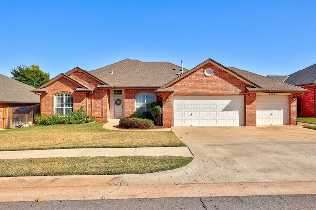 ranch-style home with a garage and a front lawn