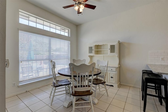 dining room featuring ceiling fan and light tile patterned flooring