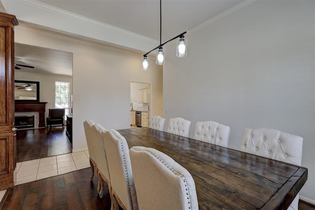 dining space featuring hardwood / wood-style floors, ceiling fan, and ornamental molding