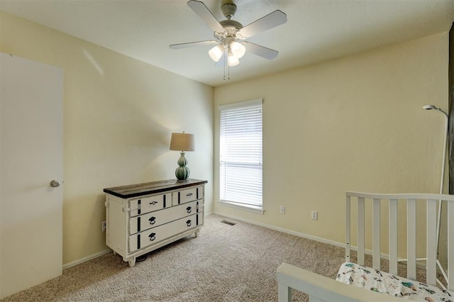 carpeted bedroom with ceiling fan