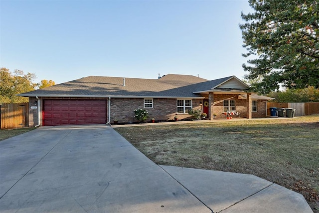 ranch-style house with a garage and a front yard