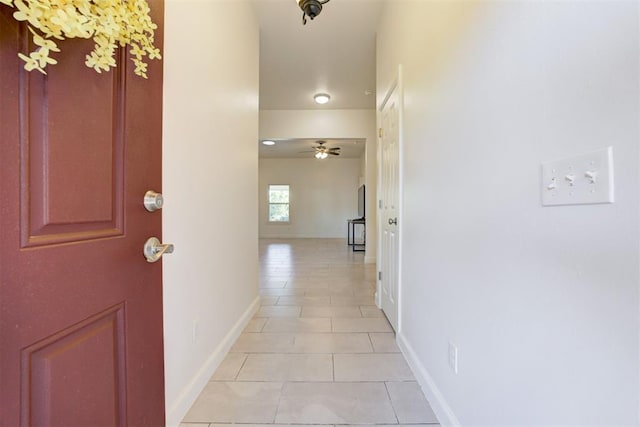 hallway with light tile patterned floors