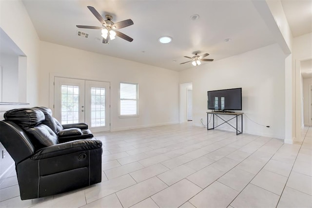 living room featuring french doors, light tile patterned floors, and ceiling fan