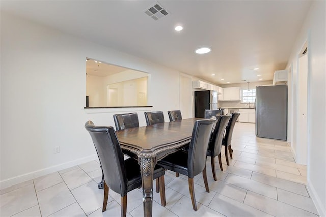 tiled dining space with sink