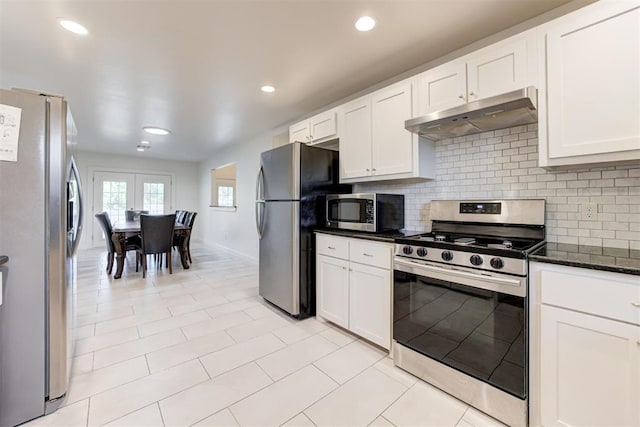 kitchen with backsplash, white cabinetry, and stainless steel appliances