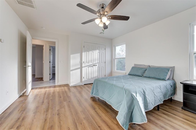 bedroom featuring ceiling fan and light hardwood / wood-style floors