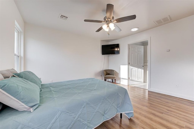 bedroom featuring hardwood / wood-style flooring and ceiling fan