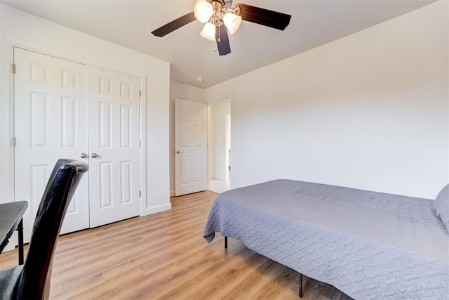 bedroom featuring a closet, ceiling fan, and light hardwood / wood-style flooring