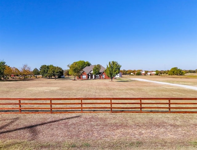 view of yard with a rural view