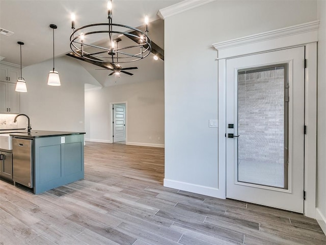 kitchen with crown molding, stainless steel dishwasher, decorative light fixtures, and light wood-type flooring