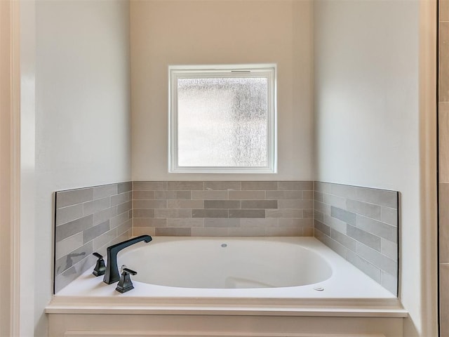 bathroom featuring a tub to relax in