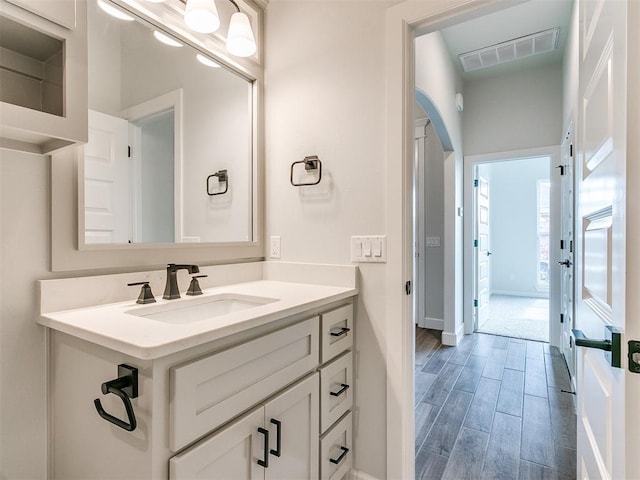 bathroom featuring hardwood / wood-style floors and vanity