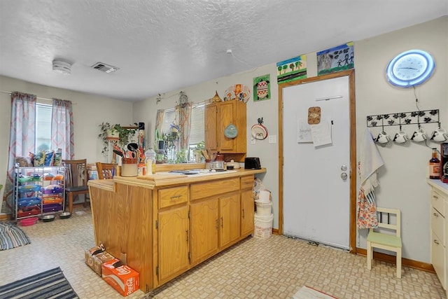 kitchen with a textured ceiling