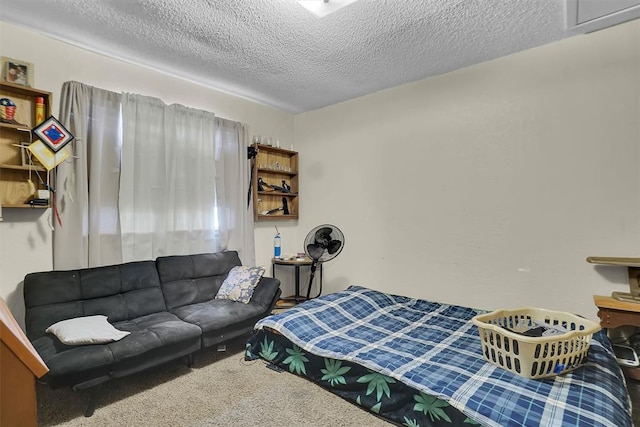 carpeted bedroom with a textured ceiling