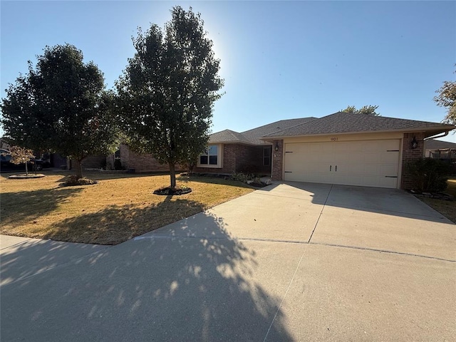 view of front of home featuring a garage and a front yard