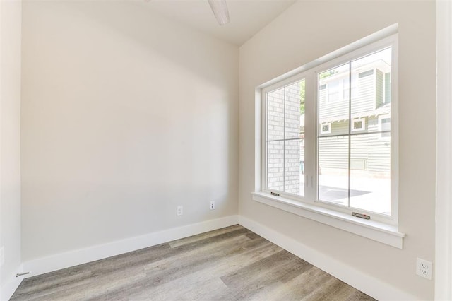 unfurnished room with light hardwood / wood-style flooring