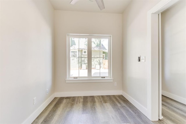 unfurnished room with ceiling fan and light wood-type flooring