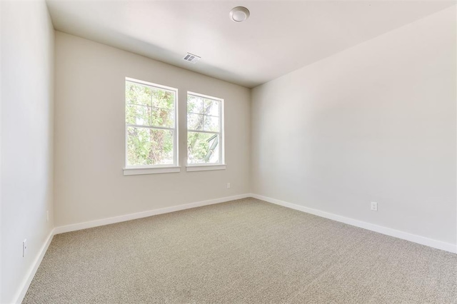 empty room with carpet flooring