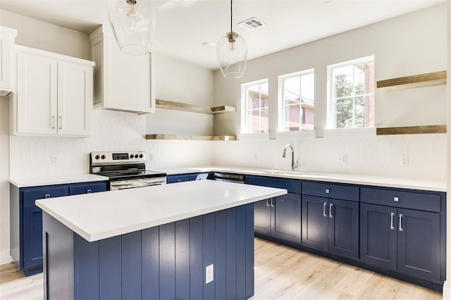 kitchen featuring a kitchen island, white cabinetry, stainless steel range with electric cooktop, and blue cabinets