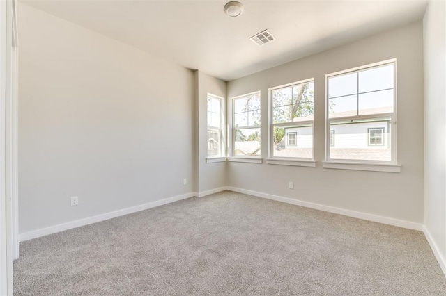 view of carpeted spare room