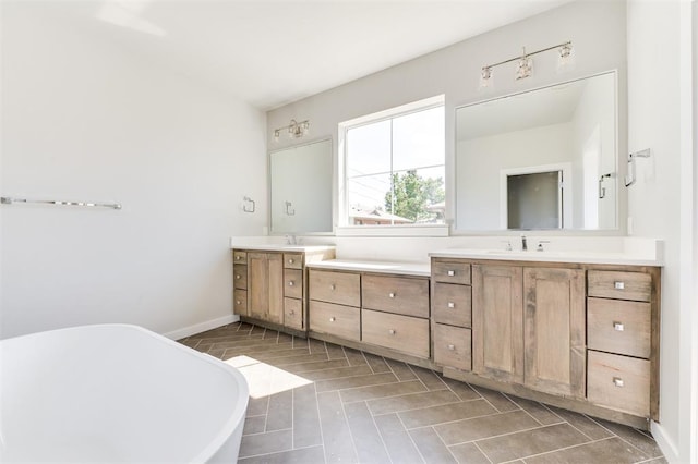 bathroom with vanity and a tub