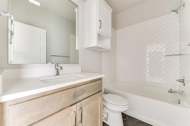 full bathroom featuring tile patterned flooring, vanity, toilet, and tiled shower / bath