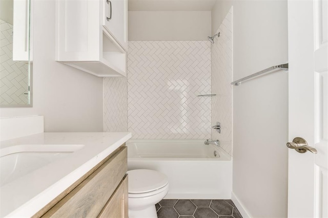 full bathroom with toilet, vanity, tile patterned floors, and tiled shower / bath