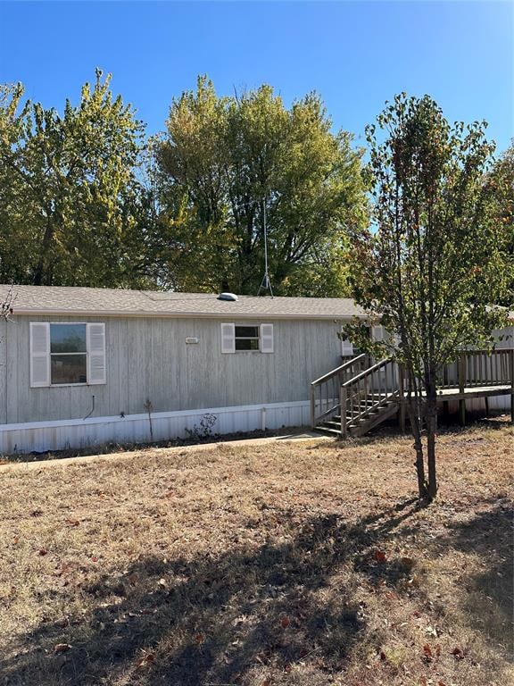 view of side of home featuring a deck