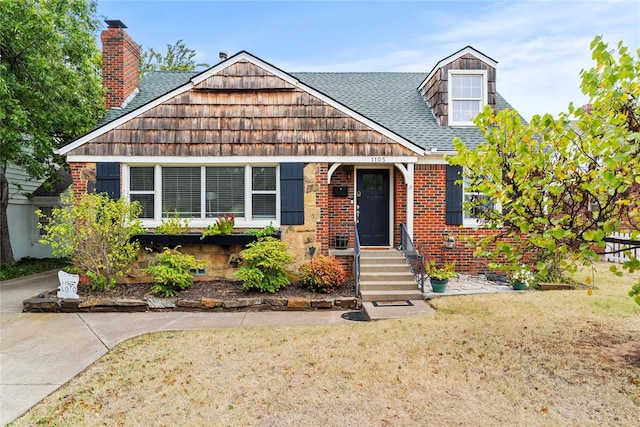 view of front of home with a front yard