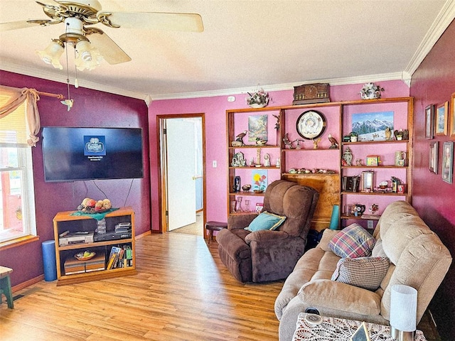 living room with ceiling fan, wood-type flooring, and crown molding