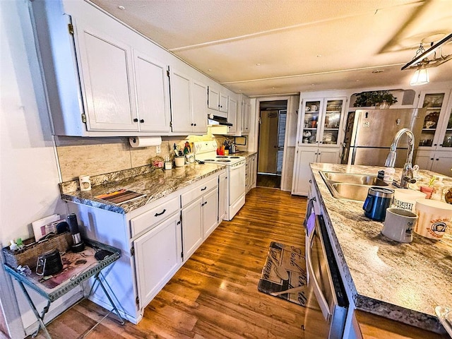 kitchen featuring white cabinetry, sink, stainless steel appliances, and stone countertops