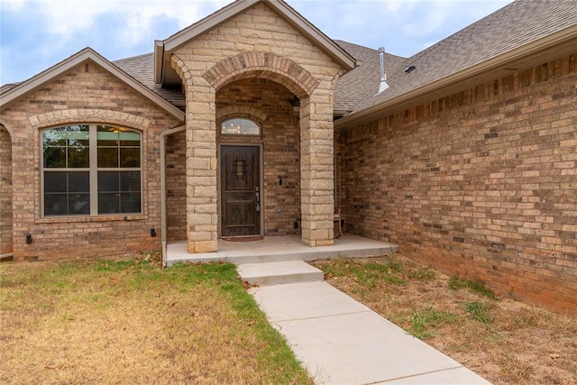 entrance to property with a yard