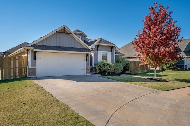 view of front facade featuring a garage and a front lawn