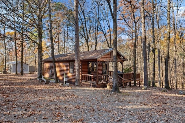 log cabin with a porch