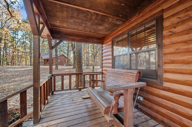 wooden terrace featuring a porch