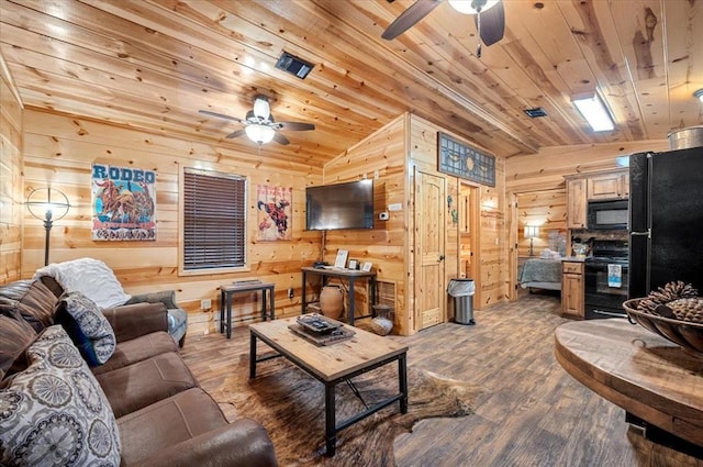 living room with hardwood / wood-style floors, wood walls, vaulted ceiling, ceiling fan, and wood ceiling