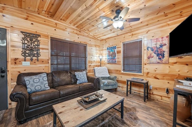 living room featuring wood ceiling, vaulted ceiling, ceiling fan, hardwood / wood-style floors, and wood walls