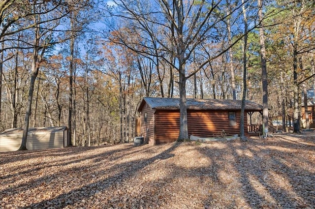 view of home's exterior featuring a storage shed