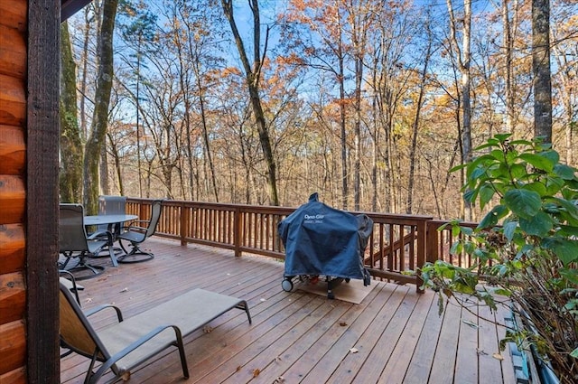 wooden deck featuring area for grilling