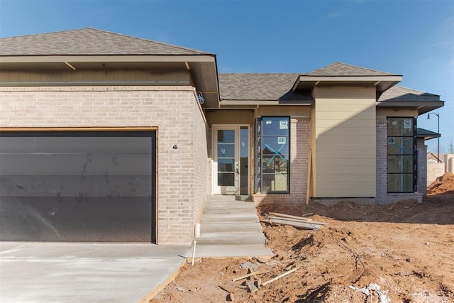 view of front of property with a garage