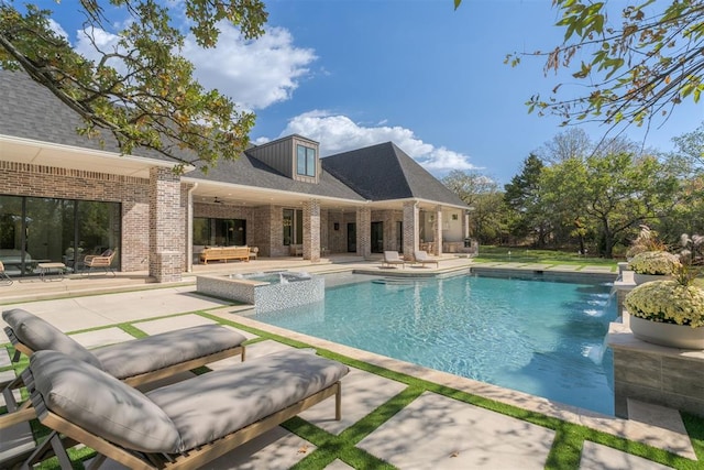 view of swimming pool featuring ceiling fan, an in ground hot tub, and a patio