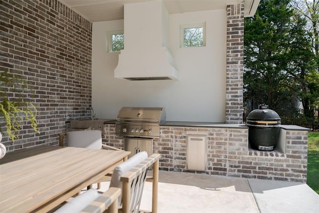 view of patio featuring sink, area for grilling, and exterior kitchen