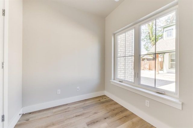 unfurnished room with light hardwood / wood-style floors