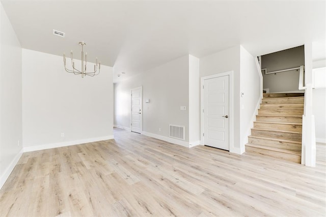 spare room featuring light hardwood / wood-style floors