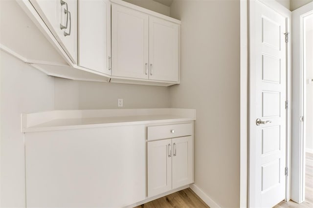 laundry room featuring light hardwood / wood-style floors