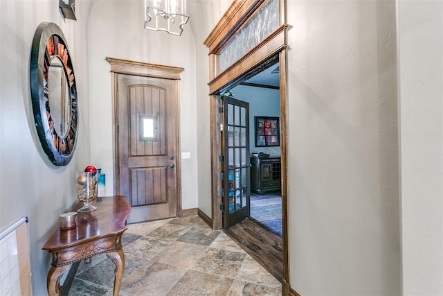 foyer entrance with a chandelier