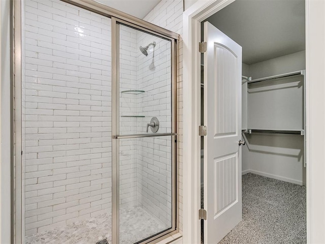 bathroom with a shower with shower door